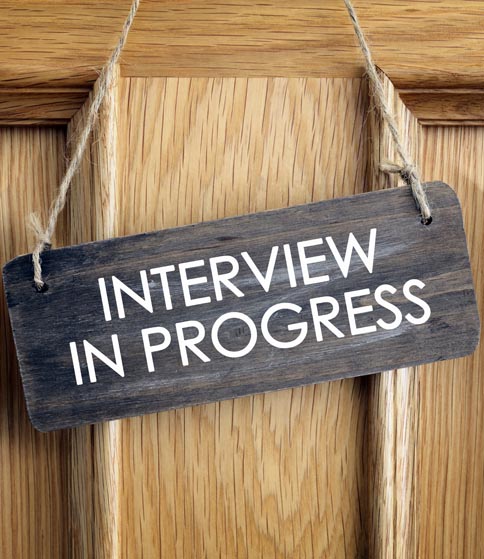 Interview in progress sign on office door