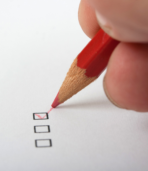 Filling in a multiple-choice checkbox with a red pencil